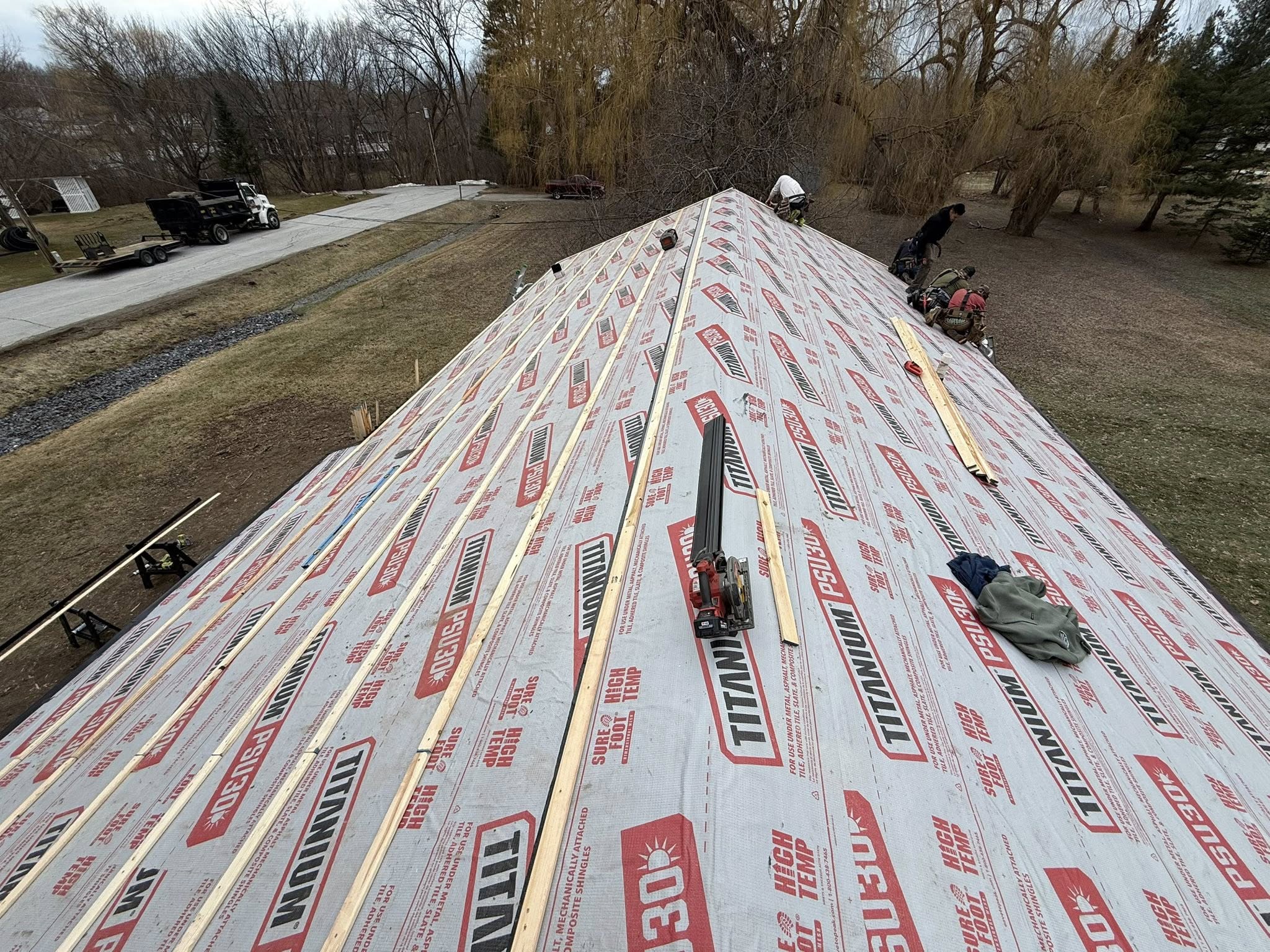 Metal roof underlayment and strapping installed